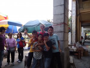 Posing with local children in Chikan, Guangdong, China