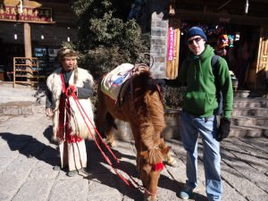 a lifestyle of travel in Shuhe Old Town ride a horse