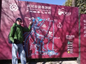 Jonny Blair at the map to Shuhe Old Town - China - a lifestyle of travel