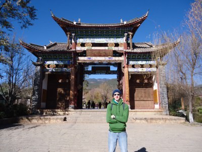 Jonny Blair at entrance to Shuhe Old Town Yunnan a lifestyle of travel