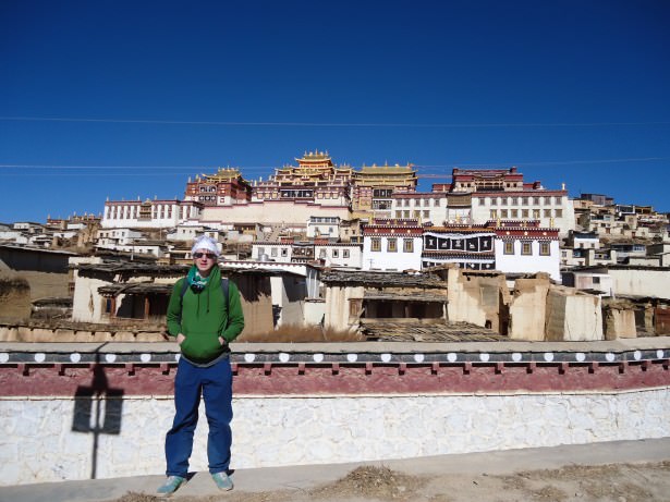 Jonny Blair at the The Ganden Sumtseling Gompa 300 year old Tibetan Monastery in Yunnan, China