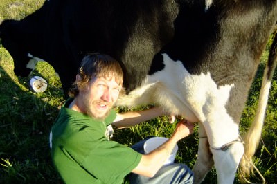 jonny blair milking cows in colombia