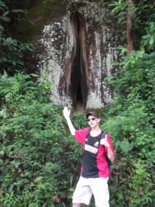 Jonny Blair at a rock shaped like a woman's private parts in China