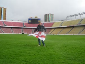 Jonny Blair the travelling Northern Irishman standing on the pitch in Estadio Hernando Siles La Paz a lifestyle of travel