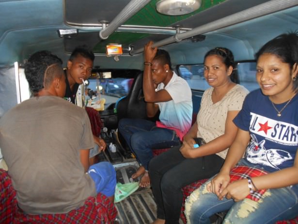 In the back of a microlet in Dili - 25 cents a ride.