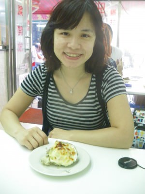 Panny the travelling Hong Kong girl in her home country enjoying cheese oysters.
