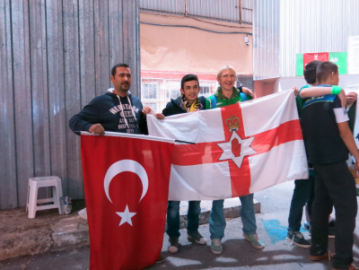 Turkey fans pose with my travelling NI flag