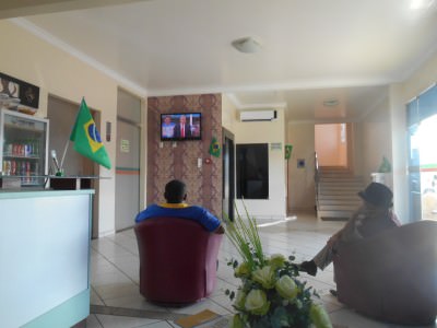 At the hotel reception in Hotel Mais, Macapa watching France dick Switzerland.