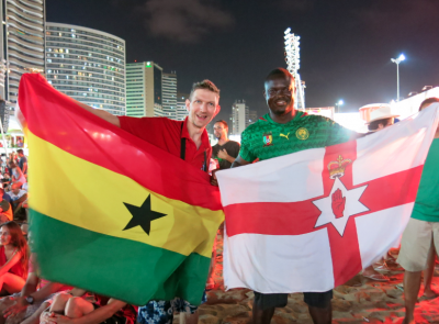 Flying the Ghana flag with Patrick while watching Cameroon v. Croatia at the Fan Fest.
