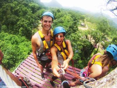 World Travellers: Jack and Jenn Zip-Lining in Laos.
