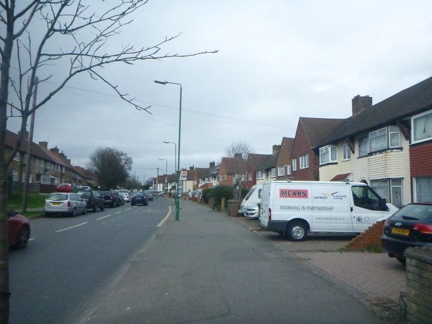 Walking on Green Wrythe Lane in Carshalton, England about to cross the border into Wrythe, Austenasia