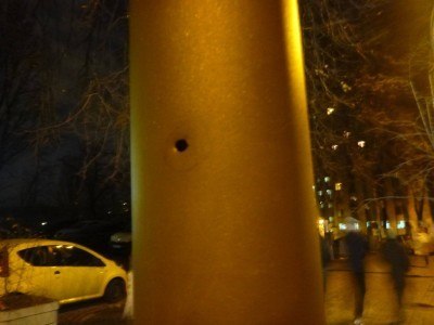 A blatant bullet hole in a lampost
