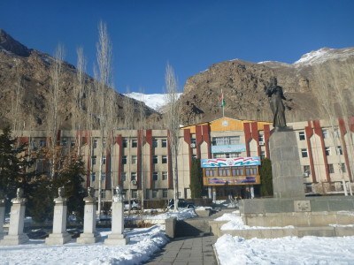 The main government building here behind the Somoni statue