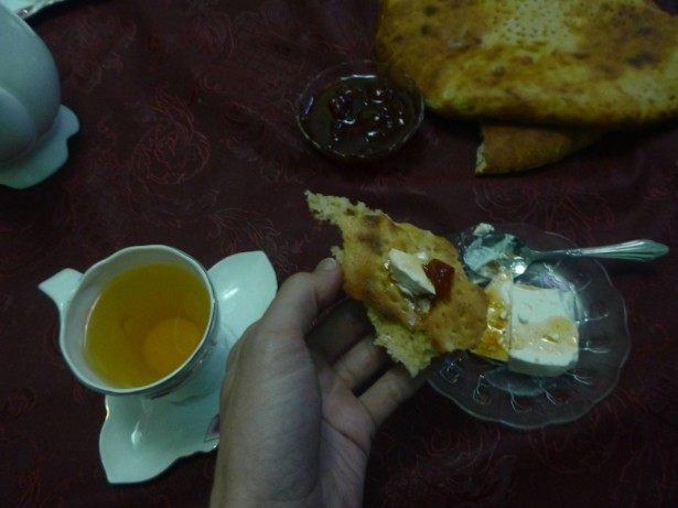 Cheese, jam, bread and tea for breakfast