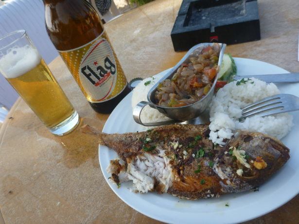 Barbecued fish and beer at N'Gor beach