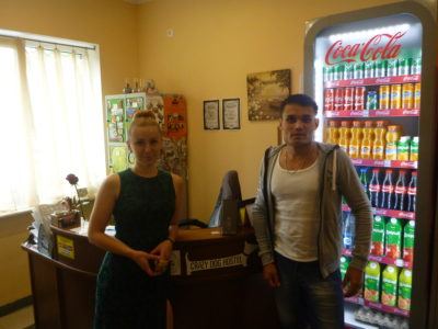 Zhenya and a customer at the Crazy Dog