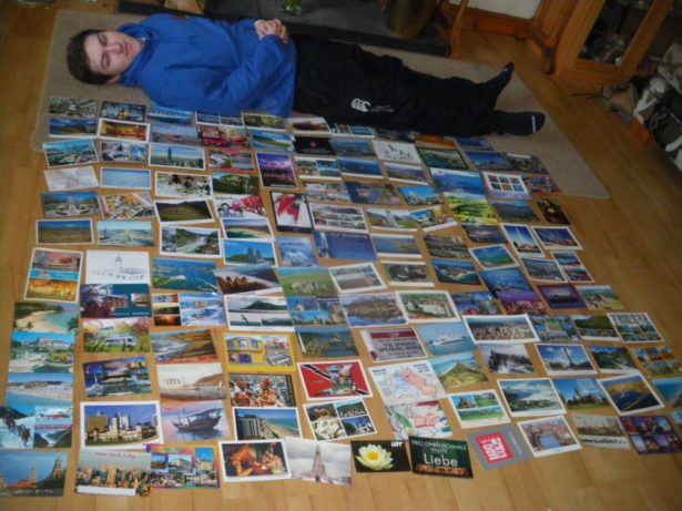 My brother Daniel and some of his hundreds of postcards from my journeys