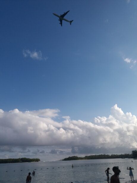 Aeroplanes from the international airport fly above your head at Blue Bay Beach, Mauritius
