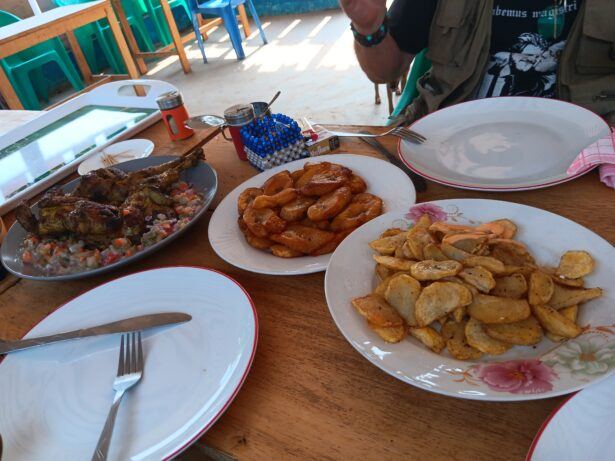 Whole roasted chicken which came with sides of salad, dried then fried apples, dried then fried plantains plus spicy sauce - lunch at Pierre D'Onyx