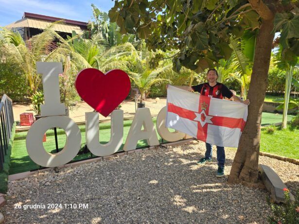 By the I Love Ouaga sign in Ouagadougou, Burkina Faso