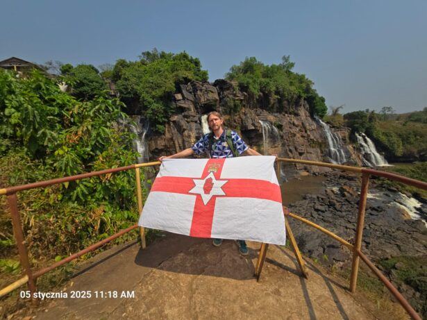 Jonny flying the Northern Ireland Flag at Boali Falls