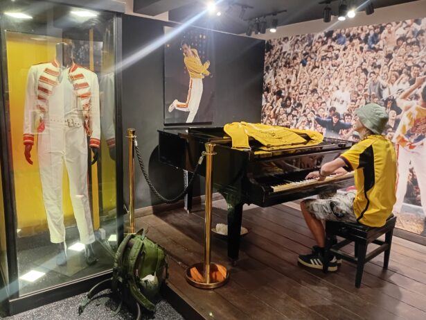 PLaying Freddie Mercury's piano. Dressed in yellow and black by fluke!